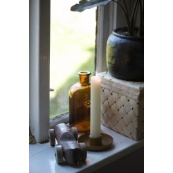 Apotekerflaske med blomsteremblem