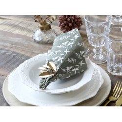 Serviet med blomster i silhuet